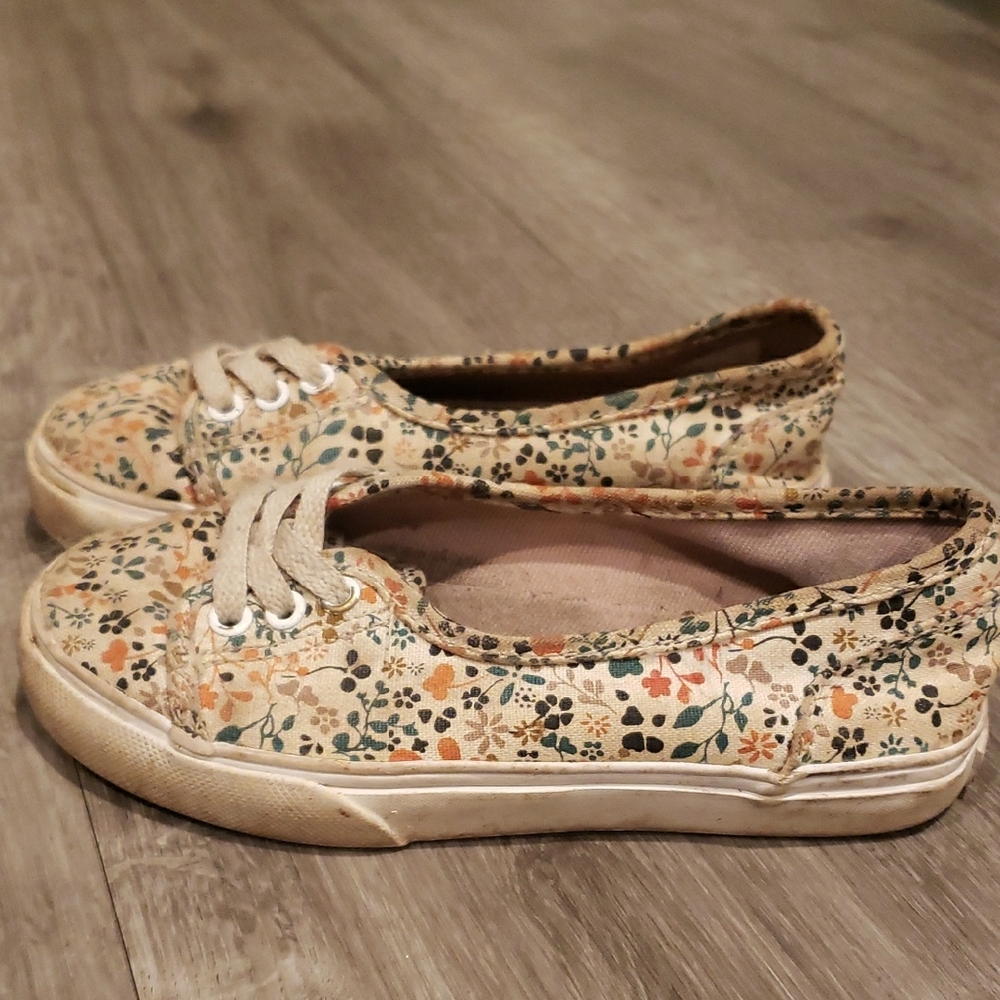 Vans Cream Slip-On Sneakers with Intricate Design
